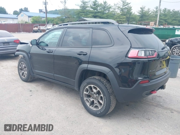 2021 Jeep Cherokee Trailhawk with VIN 1C4PJMBX0MD167941, listed as a IAAI auction lot 42507379 with 70,414 mi miles and . Bid and sale history available at DreamBid. Image 3.