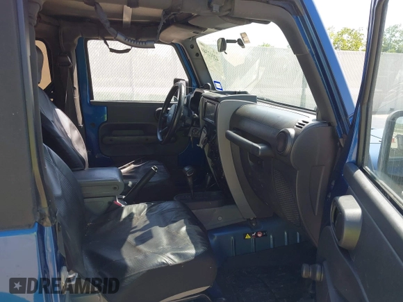 2010 Jeep Wrangler Sport with VIN 1J4AA2D11AL117404, listed as a IAAI auction lot 42012340 with 266,310 mi miles and . Bid and sale history available at carsss.com. Image 5.