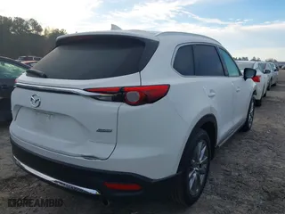2016 Mazda CX-9 Grand Touring with VIN JM3TCBDY3G0116309, listed as a IAAI auction lot 40890199 with 64,948 mi miles. Bid and sale history available at carsss.com. Image 4.