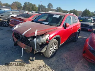 2015 Mazda CX-5 Touring with VIN JM3KE4CY6F0455468, listed as a IAAI auction lot 40669780 with 225,831 mi miles and . Bid and sale history available at carsss.com. Image 2.
