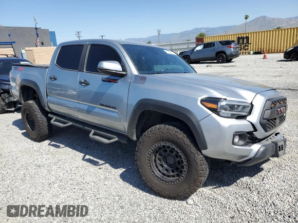 2023 Toyota Tacoma SR with VIN 3TMCZ5AN8PM545588, listed as a Copart auction lot 57528655 with 73,286 mi miles and Salvage title. Bid and sale history available at DreamBid. Image 4.