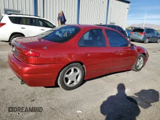 1998 Ford Contour z VIN 1FALP68G4WK119895, wystawiony jako Copart lot #81341764 z przebiegiem 103 748 mil mil oraz Szkody całkowita. Historia ofert i sprzedaży dostępna na DreamBid. Obrazek 3.