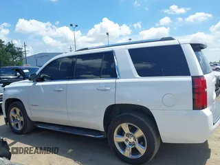 2020 Chevrolet Tahoe LTZ with VIN 1GNSCCKCXLR215899, listed as a IAAI auction lot 40128171 with 109,541 mi miles and . Bid and sale history available at DreamBid. Image 14.
