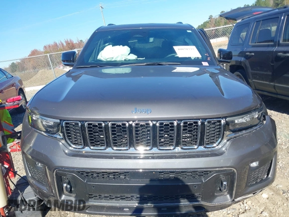 2022 Jeep Grand Cherokee Overland z VIN 1C4RJJDG6N8570854, wystawiony jako IAAI lot #40878737 z przebiegiem 19 947 mil mil oraz . Historia ofert i sprzedaży dostępna na DreamBid. Obrazek 13.