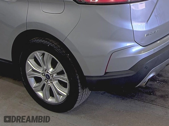 2020 Ford Edge Titanium z VIN 2FMPK4K91LBA91290, wystawiony jako IAAI lot #42494043 z przebiegiem 71 254 mil mil oraz . Historia ofert i sprzedaży dostępna na DreamBid. Obrazek 9.