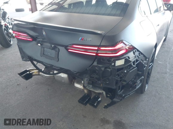 2025 BMW 5 Series with VIN WBS83FK04SCU11874, listed as a IAAI auction lot 42543784 with 4,517 mi miles and . Bid and sale history available at DreamBid. Image 17.