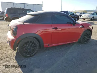 2015 MINI Coupe S z VIN WMWSX3C59FT409468, wystawiony jako Copart lot #71401384 z przebiegiem Nie podano mil oraz Szkody całkowita. Historia ofert i sprzedaży dostępna na DreamBid. Obrazek 3.