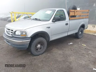 1999 Ford F-150 with VIN 2FTZF1828XCA85643, listed as a IAAI auction lot 41347113 with 173,813 mi miles and . Bid and sale history available at DreamBid. Image 2.
