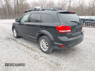 2014 Dodge Journey SXT with VIN 3C4PDCBG1ET142687, listed as a IAAI auction lot 41698232 with 170,521 mi miles. Bid and sale history available at carsss.com. Image 3.