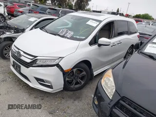 2020 Honda Odyssey Touring with VIN 5FNRL6H81LB028083, listed as a IAAI auction lot 42003810 with 71,536 mi miles and . Bid and sale history available at DreamBid. Image 19.
