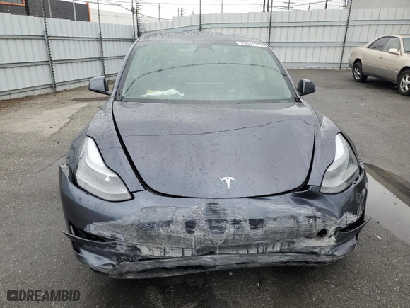2021 Tesla Model 3 Standard Range Plus with VIN 5YJ3E1EA1MF911340, listed as a Copart auction lot 45011375 with 54,084 mi miles and Salvage Title. Bid and sale history available at carsss.com. Image 5.