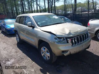 2011 Jeep Grand Cherokee Laredo with VIN 1J4RR4GG8BC590094, listed as a IAAI auction lot 41990149 with 178,510 mi miles. Bid and sale history available at carsss.com. Image 1.
