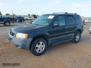 2003 Ford Escape XLT Popular 2 with VIN 1FMYU93113KE18944, listed as a IAAI auction lot 42056372 with 244,942 mi miles. Bid and sale history available at carsss.com. Image 2.