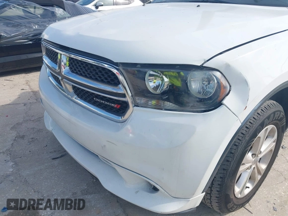 2013 Dodge Durango Crew with VIN 1C4RDHDGXDC608209, listed as a IAAI auction lot 42779231 with 203,460 mi miles and . Bid and sale history available at DreamBid. Image 6.