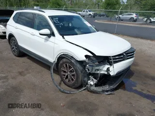 2021 Volkswagen Tiguan SE with VIN 3VV2B7AX5MM057743, listed as a IAAI auction lot 42471192 with 80,133 mi miles and . Bid and sale history available at DreamBid. Image 1.