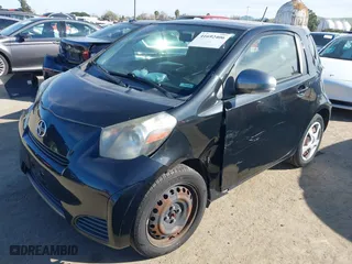 2012 Scion iQ with VIN JTNJJXB02CJ018324, listed as a IAAI auction lot 41692406 with 162,445 mi miles. Bid and sale history available at carsss.com. Image 2.