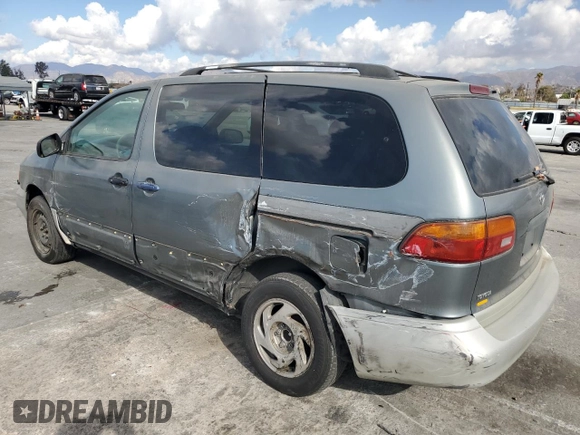 1999 Toyota Sienna LE with VIN 4T3ZF13C6XU128055, listed as a Copart auction lot 81100934 with 0 mi miles and Salvage Title. Bid and sale history available at carsss.com. Image 2.