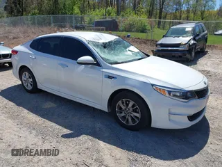 2016 Kia Optima LX z VIN 5XXGT4L3XGG080662, wystawiony jako IAAI lot #42048361 z przebiegiem 99 564 mil mil oraz . Historia ofert i sprzedaży dostępna na DreamBid. Obrazek 1.