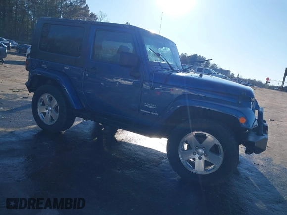 2009 Jeep Wrangler Sahara z VIN 1J4FA54199L722192, wystawiony jako IAAI lot #41619305 z przebiegiem 105 545 mil mil oraz . Historia ofert i sprzedaży dostępna na DreamBid. Obrazek 1.