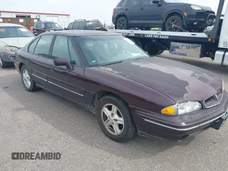 1999 Pontiac Bonneville SE z VIN 1G2HX52K0XH243642, wystawiony jako IAAI lot #40567276 z przebiegiem 188 903 mil mil oraz . Historia ofert i sprzedaży dostępna na DreamBid. Obrazek 1.