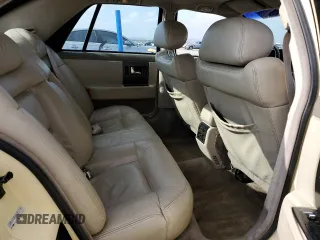 1992 Cadillac Seville z VIN 1G6KS53B0NU837105, wystawiony jako Copart lot #55865205 z przebiegiem 94 740 mil mil oraz Szkody całkowita. Historia ofert i sprzedaży dostępna na DreamBid. Obrazek 10.