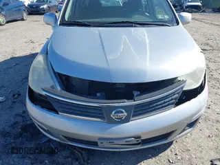 2009 Nissan Versa 1.8 SL with VIN 3N1BC13E09L393563, listed as a IAAI auction lot 41977998 with 163,072 mi miles. Bid and sale history available at carsss.com. Image 6.