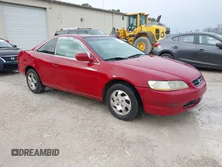 1999 Honda Accord EX z VIN 1HGCG3258XA027813, wystawiony jako IAAI lot #41476354 z przebiegiem 196 983 mil mil oraz . Historia ofert i sprzedaży dostępna na DreamBid. Obrazek 1.