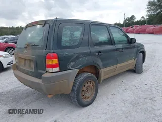 2002 Ford Escape with VIN 1FMCU02132KD51298, listed as a IAAI auction lot 41550132 with 218,830 mi miles and . Bid and sale history available at DreamBid. Image 4.
