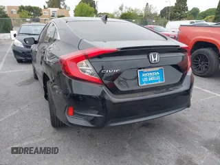 2016 Honda Civic Sedan EX-T with VIN 2HGFC1F34GH645220, listed as a IAAI auction lot 42043630 with 55,301 mi miles. Bid and sale history available at carsss.com. Image 3.