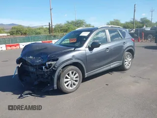 2014 Mazda CX-5 Sport with VIN JM3KE2BE4E0414721, listed as a IAAI auction lot 41408914 with Not Provided miles and . Bid and sale history available at carsss.com. Image 2.