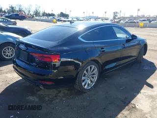 2018 Audi A5 Sportback Premium z VIN WAUANCF53JA009200, wystawiony jako IAAI lot #41725501 z przebiegiem 107 076 mil mil oraz . Historia ofert i sprzedaży dostępna na DreamBid. Obrazek 4.