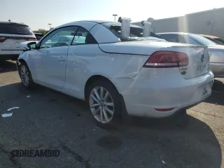 2015 Volkswagen Eos Komfort with VIN WVWBW8AH8FV002701, listed as a Copart auction lot 68676484 with 11,646 mi miles and Salvage Title. Bid and sale history available at DreamBid. Image 2.