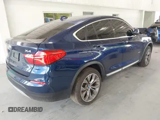 2015 BMW X4 xDrive28i with VIN 5UXXW3C51F0M87268, listed as a IAAI auction lot 42366363 with 143,285 mi miles and . Bid and sale history available at DreamBid. Image 4.