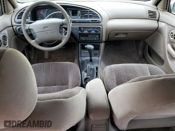 1996 Ford Contour with VIN 3FALP6535TM129390, listed as a Copart auction lot 73338064 with 87,588 mi miles and Salvage title. Bid and sale history available at DreamBid. Image 8.