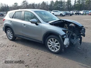 2013 Mazda CX-5 Grand Touring with VIN JM3KE4DE2D0115154, listed as a IAAI auction lot 41706007 with 153,532 mi miles. Bid and sale history available at carsss.com. Image 1.