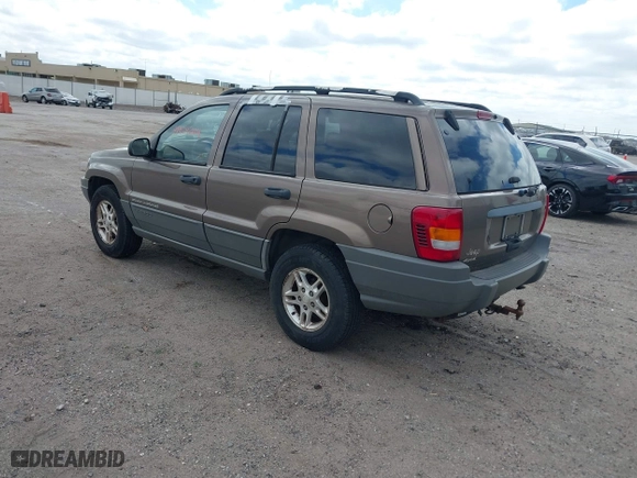 2002 Jeep Grand Cherokee Laredo with VIN 1J4GW48S32C123720, listed as a IAAI auction lot 41909204 with 157,996 mi miles. Bid and sale history available at carsss.com. Image 3.