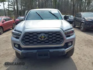 2022 Toyota Tacoma SR with VIN 3TMCZ5ANXNM497511, listed as a IAAI auction lot 41670710 with 26,277 mi miles and . Bid and sale history available at DreamBid. Image 12.