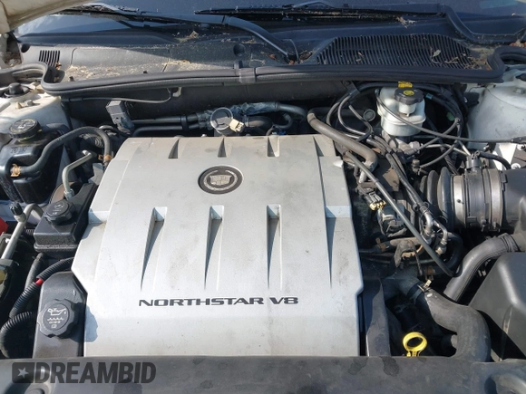 2004 Cadillac DeVille DHS z VIN 1G6KE57Y24U260694, wystawiony jako IAAI lot #42235533 z przebiegiem 156 689 mil mil oraz . Historia ofert i sprzedaży dostępna na DreamBid. Obrazek 10.