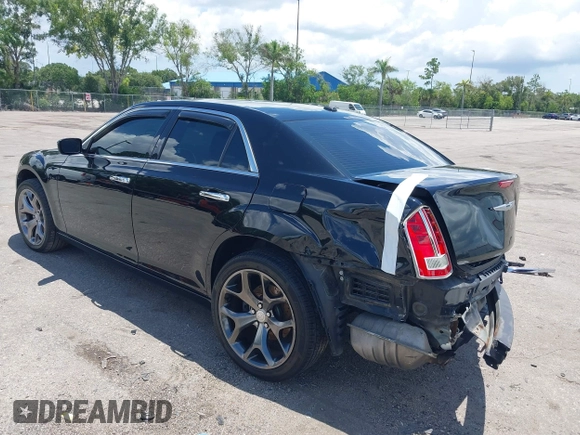 2014 Chrysler 300 C with VIN 2C3CCAKT9EH171614, listed as a IAAI auction lot 39747704 with 129,156 mi miles and . Bid and sale history available at carsss.com. Image 3.