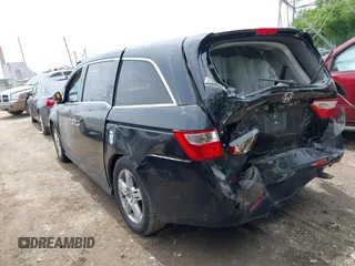 2012 Honda Odyssey Touring with VIN 5FNRL5H91CB121950, listed as a IAAI auction lot 42456620 with 200,831 mi miles and . Bid and sale history available at DreamBid. Image 3.