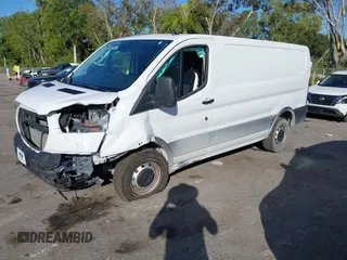 2023 Ford Transit Cargo with VIN 1FTBR1Y81PKB93787, listed as a IAAI auction lot 41253973 with 16,058 mi miles and . Bid and sale history available at DreamBid. Image 18.