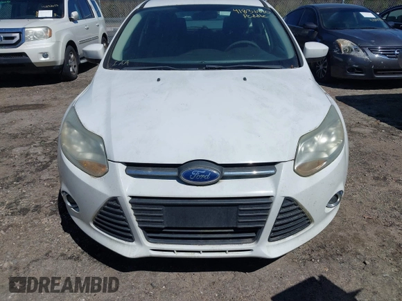 2012 Ford Focus SE z VIN 1FAHP3K25CL122733, wystawiony jako IAAI lot #41836880 z przebiegiem 125 439 mil mil oraz . Historia ofert i sprzedaży dostępna na DreamBid. Obrazek 6.