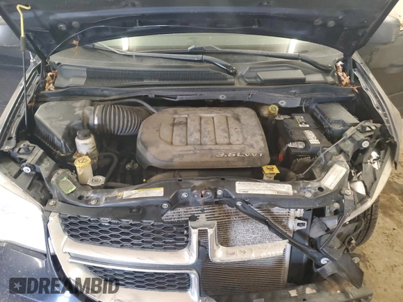 2012 Dodge Grand Caravan SE with VIN 2C4RDGBG2CR333664, listed as a Copart auction lot 46734485 with 211,138 mi miles and Salvage Title. Bid and sale history available at DreamBid. Image 12.