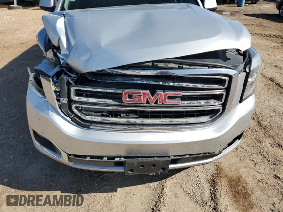2017 GMC Yukon SLT with VIN 1GKS2BKC9HR345688, listed as a Copart auction lot 52303075 with 122,969 mi miles and Salvage Title. Bid and sale history available at carsss.com. Image 14.
