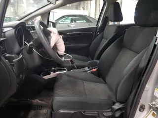 2015 Honda Fit LX с VIN 3HGGK5H56FM720996, выставлен на аукционе Copart как лот 57565945 с пробегом 90 222 миль миль и Списание • Salvage title. История ставок и продаж доступна на DreamBid. Изображение 7.