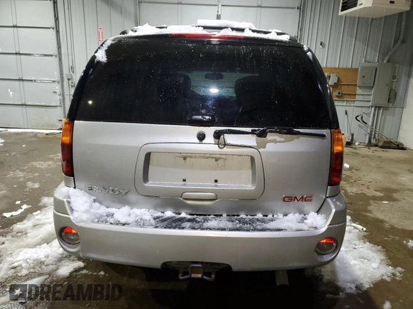 2005 GMC Envoy SLT with VIN 1GKDT13SX52287052, listed as a Copart auction lot 44387855 with 0 mi miles and Salvage Title. Bid and sale history available at carsss.com. Image 6.