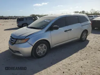 2014 Honda Odyssey LX z VIN 5FNRL5H23EB063149, wystawiony jako Copart lot #49768165 z przebiegiem 199 579 mil mil oraz Szkoda całkowita • Salvage title. Historia ofert i sprzedaży dostępna na DreamBid. Obrazek 1.