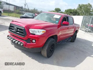 2022 Toyota Tacoma SR with VIN 3TYAX5GN1NT039848, listed as a IAAI auction lot 41210811 with 93,670 mi miles and . Bid and sale history available at DreamBid. Image 2.