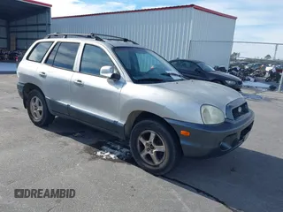 2002 Hyundai Santa Fe GLS z VIN KM8SC13D42U202223, wystawiony jako IAAI lot #41338701 z przebiegiem 228 620 mil mil oraz . Historia ofert i sprzedaży dostępna na DreamBid. Obrazek 1.