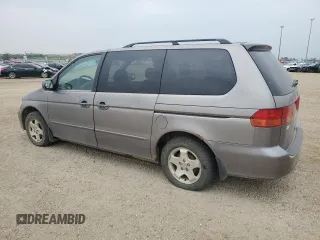 2000 Honda Odyssey EX z VIN 2HKRL186XYH010384, wystawiony jako Copart lot #60871845 z przebiegiem 423 167 mil mil oraz Czysty tytuł • Clean title. Historia ofert i sprzedaży dostępna na DreamBid. Obrazek 2.